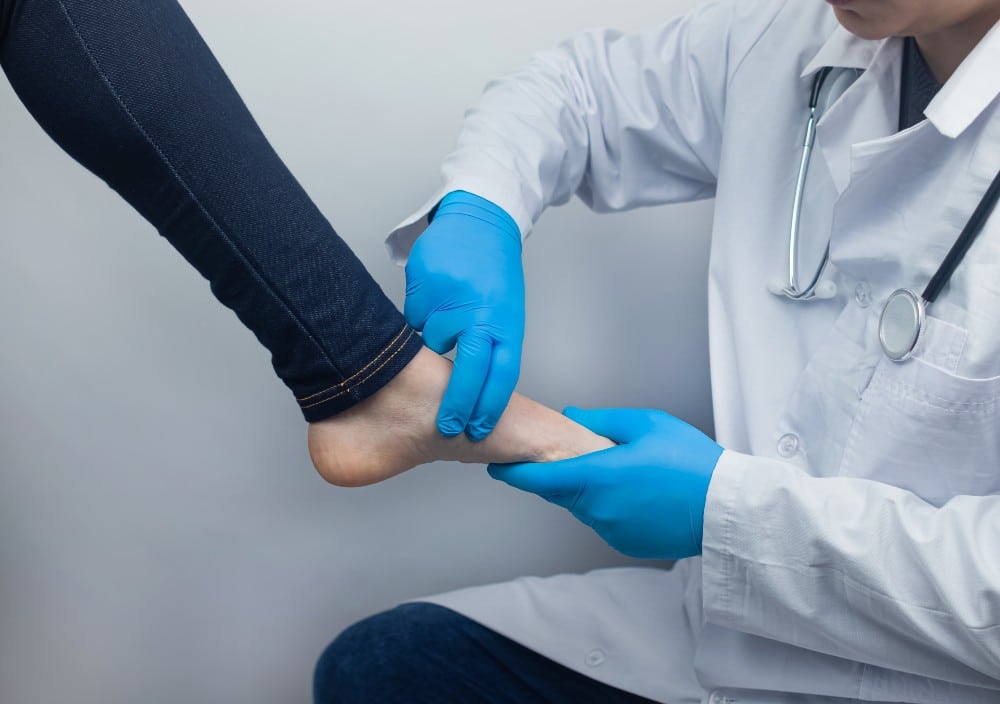 Podiatrist treating heel pain causes